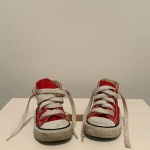 Converse red and white high top shoes size 4.